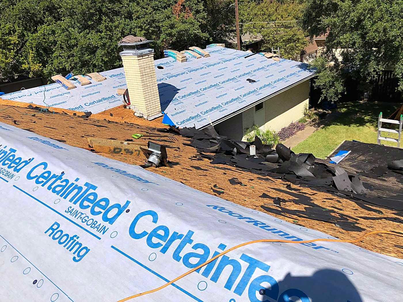 CertainTeed RoofRunner underlayment laid over decking with the old shingles torn off